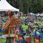 A wooden bird sculpture looks on and over attendees during Salmonfest 2025 on Friday, Aug. 2, at the Kenai Peninsula Fairgrounds in Ninilchik. (Chloe Pleznac/Homer News)