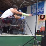 Trevor Edwards performs the 2-foot high kick during a Native Youth Olympics demonstration at the Inlet Stage on Saturday, Aug. 2, 2025, at the Kenai Peninsula Fairgrounds in Ninilchik, Alaska. (Delcenia Cosman/Homer News)