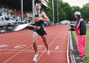 Isaac Updike breaks the tape at the Portland Track Festival. (Photo by Amanda Gehrich/pdxtrack)