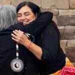 Dr. Ramona Klein, left, who attended the Fort Totten Boarding School in North Dakota, hugs Deborah Parker, the chief executive the National Native American Boarding School Healing Coalition, after presenting her with a beaded NABS medallion on Tuesday, Sept. 16, 2025, at a National Day of Remembrance of boarding school survivors and families hosted by NABS in Washington, D.C. (Credit: Charles Fox for ICT)