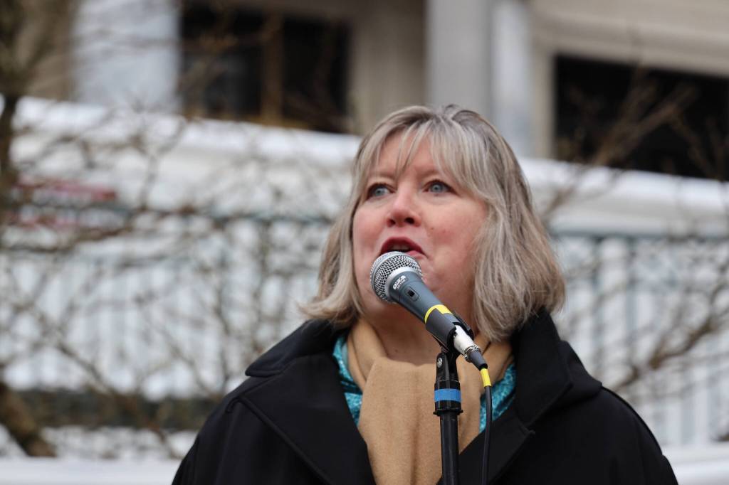 Rep. Sara Hannan, D-Juneau addresses a crowd during a rally outside the Alaska State Capitol in 2023. Hannan sponsored a bill during the 33rd Legislature that sought to ban licensed practitioners from performing conversion therapy in the state. (Clarise Larson / Juneau Empire file photo)