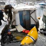 Crew and divers at Melinos Marine Service re-float a sunken boat in Harris harbor on Jan. 8, 2026. (Chloe Anderson for the Juneau Empire)