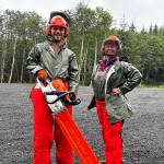 Trail workers pose in uniform.