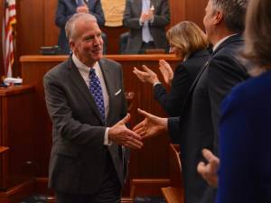 Photo by James Brooks/Alaska Beacon 
U.S. Sen. Dan Sullivan, R-Alaska, prepares to shake hands with one of his critics, state Rep. Andrew Gray, D-Anchorage, after the conclusion of his speech to the Alaska Legislature on Thursday, March 20, 2025.