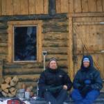 Ned Rozell, left, and Andy Sterns of Fairbanks have dinner outside Tripod Flat cabin between Kaltag and Unalakleet in March 2001. Photo courtesy Ned Rozell