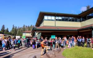 School buses arrive at the Dzantiki Heeni campus. (Jasz Garrett/Juneau Empire)