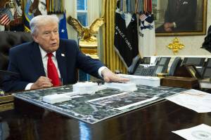 Doug Mills/The New York Times
President Donald Trump with a model of his proposed ballroom, in the Oval Office of the White House in Washington, Dec. 12, 2025.