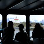 Passengers on the M/V Seawolf look out at the Eldred Rock Lighthouse on the day of the public opening on May 30, 2026. (Photo by Corinne Smith/Alaska Beacon)