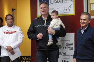 Alaska Gov.-elect Mike Dunleavy, center, speaks to supporters at his campaign headquarters on Monday. Dunleavy announced a handful of appointments Thursday, including Brett Huber, at left, as senior policy adviser. (Becky Bohrer | The Associated Press File)