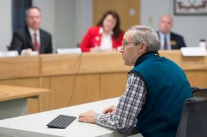Doug Woodby, co-chair of climate action group @350 Juneau, speaks to the Alaska Permanent Fund Corporations Board of Trustees during its quarterly meeting in Juneau on Tuesday, Dec. 11, 2018. The local chapter of the national environmental group has been asking the trustees to divest from fossil fuel investments.
